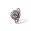 Bague en or bicolore avec diamant central et entourage de saphirs rose et diamants