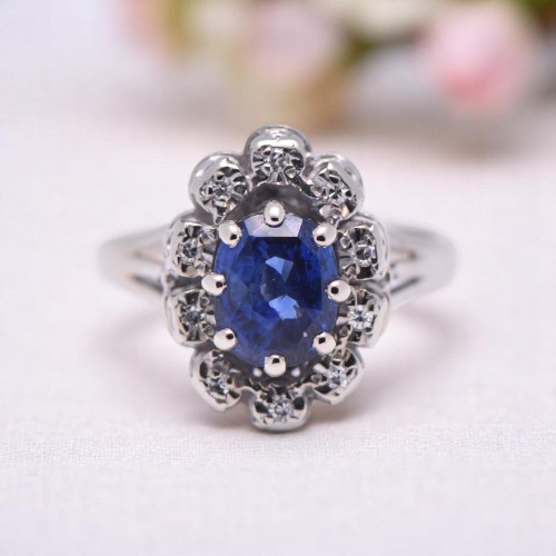 Bague marguerite vintage avec saphir ovale et entourage diamants, Nantes